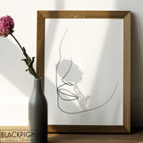 Mockup affiche minimaliste en noir et blanc d'un portrait abstrait en line art, dessin de Lara.